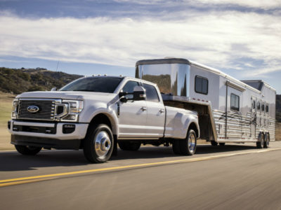 F-white-2020-Ford-F-450-Super-Duty-towing-a-camper_o